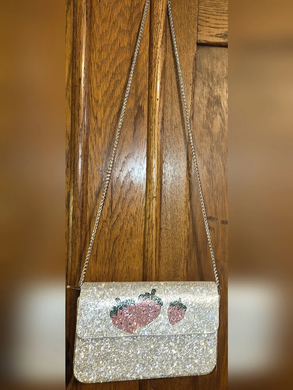 NWT's Rhinestone-encrusted silver clutch from the brand Anna & Elle, Strawberry